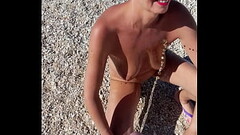 German Milf Sandra gets golden Shower on the beach Thumb